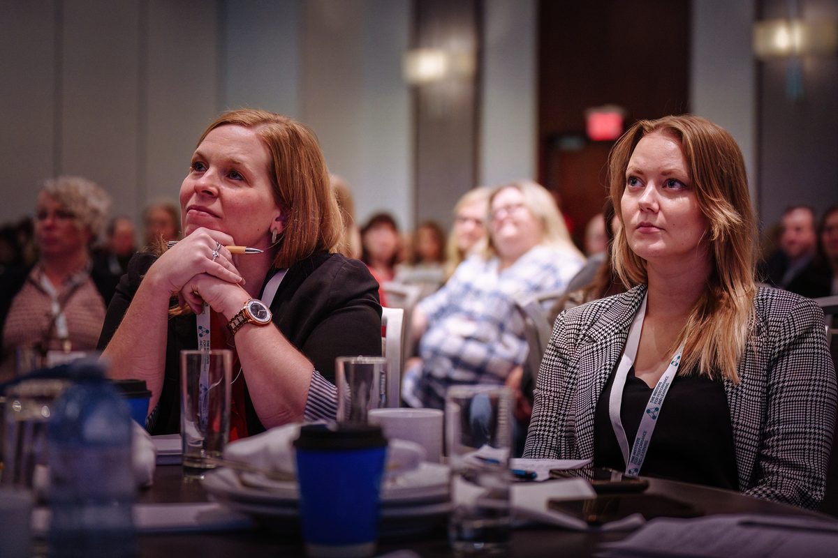 Member taking notes during a session.